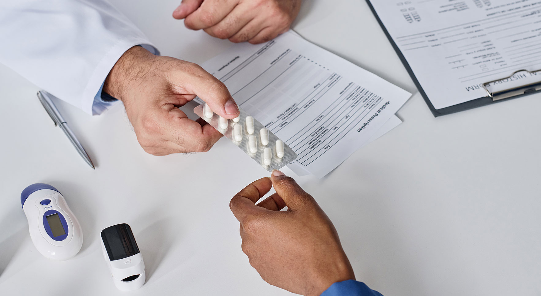 Doctor giving medicine to patient